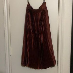 Burgundy Metallic mid length skirt with side zipper